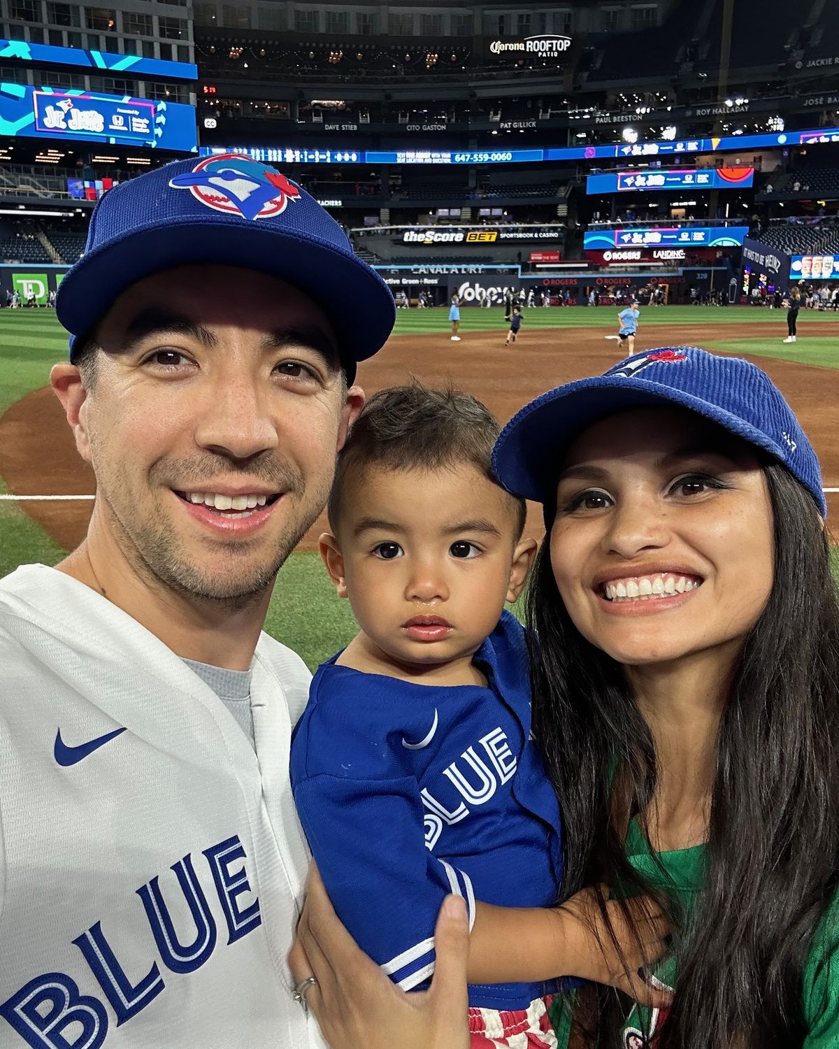 Bennett Fitzgibbon with his wife and son at a Blue Jays game in Toronto